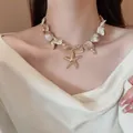 Close-up detail of a resort-style handmade shell necklace with a gold starfish pendant - 4# Necklace (Gold-Brown)
