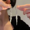Elegant silver leaf tassel drop earrings featuring long shimmering rhinestone fringe - Hoop Tassel Style (Hoop Clasp)