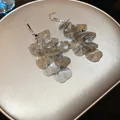 Detailed view of silver leaf tassel earrings with fine textured overlapping petals. - Rhinestone Leaf Tassel (8#) / Silver