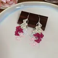 Detailed macro view of butterfly tassel earrings with colorful gradient metal filigree - Gradient Pink White Butterfly Style (Ear Hook)