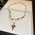 Elegant gold double-layered necklace featuring four-pointed star charms and brown beads - 44# Necklace - Star Beaded / Gold Brown