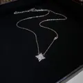Exquisite gold star pendant necklace with sparkling crystals displayed on black jewelry box - 45# Necklace - Starburst Pendant / Gold