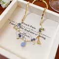 Handmade gold necklace with pearls and blue beads featuring star and moon charms. - 50# Necklace (Gold-Blue)