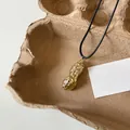 Unique gold peanut pendant necklace with black cord cord, minimalist style jewelry. - 70# Peanut Shape Necklace (HN8438) / Gold