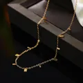 Elegant gold necklace with small square pendants featured in a minimalist fashion design - 68# Necklace (68#) / Gold