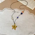 Handmade resort style necklace with yellow starfish pendant and colorful beads on black cord. - 58# Necklace (58#) / Yellow