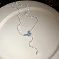Elegant Y-shaped white pearl necklace featuring a sparkling blue butterfly crystal pendant - 89# Necklace (89#) / Silver-Blue