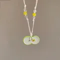 Handmade vacation style woven necklace with green ceramic pendant and yellow beads - Bean Shaped Pendant (60#) / Green