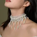 Close-up detail of a vintage French palace style lace choker with elegant dangling pearls. - Necklace / White