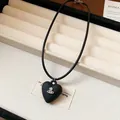 Stylish black heart pendant cord necklace featuring an iconic silver-tone metal orb logo - 83# Necklace / Silver-Black