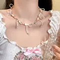 Detailed close-up of a colorful Y2K dopamine beaded necklace with pink bow on Asian model. - 17# Necklace Tassel Bow / Colorful