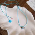 Handmade blue braided necklace featuring cute dachshund and evil eye flower pendants - 100# Necklace - Blue & Red