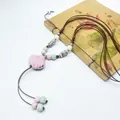 Handmade pink ceramic shell pendant necklace featuring bohemian beads and a brown braided cord - 103# Necklace - Pink & Multi-color