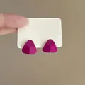 Detail view of vibrant magenta minimalist triangle stud earrings on a white card - Triangle / Silver Needle - Rose Red