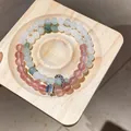 Close-up of beaded gemstone bracelets with elegant silver floral and square charms. - Style 11 (Double Layer) / Pink-Light Green