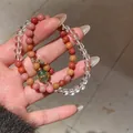 Macro view of vintage Maillard style tiger eye and crystal beaded bracelet for women - Style 42 (Multi-Wrap Vintage) / Pink-Clear