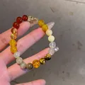 Close-up of multi-colored gemstone bracelet with tiger eye and citrine beads - Style 43 (Vintage High-End) / Yellow-Coffee