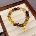 Elegant handmade tiger's eye and yellow crystal bead bracelet featuring a gold floral charm - Style 48 (Flower Pendant) / Yellow-Coffee