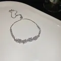 Eleganter silberner verstellbarer Zugarmreif mit quadratischen Zirkonia-Steinen - Vier-Steine Quadratischer Zirkonia-Stil (85#) / Silber