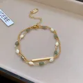 Detailed view of a French retro double-layer bracelet with green and white beads - Gold-Yellow