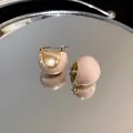 Detailed macro view of retro gold-plated bean hoop earrings with elegant nude enamel finish. - Bean Ear Buckle Style (1#)
