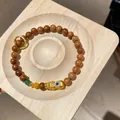 Vintage Maillard brown wood bead bracelet with gold Pixiu charm and green accent - Style 59 (Gold Pixiu) / Gold Brown