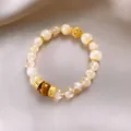 Luxury Citrine and Tiger's Eye beaded bracelet featuring vintage golden hollow craft beads - Style 64 (Hollow Flower) / Gold-Light Yellow