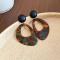 Close-up of vintage tortoise shell earrings with a textured black stud finish. - Dark Coffee Teardrop (4#)