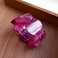 Close-up of fuchsia acrylic bracelet with elegant marble print and glossy finish - Purple