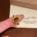 Elegante anello aperto retrò placcato oro 18k con pietra occhio di tigre e zirconi - Stile 2 (Bordo in Pizzo Vintage Ovale) / Placcato Oro 18K / Marrone oro