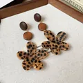 Detailed shot of leopard print flower earrings with wooden accents in vintage Maillard style - Irregular Flower Style (HE29208) / Silver Post Coffee