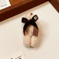 Macro view of a cute beige flocked bear brooch decorated with a dark brown velvet bow - Bow Bear (8#)