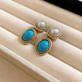 Detailed view of French vintage earrings with pearls and oval turquoise in gold frames - Oval Pearl Turquoise Earrings (2) / Silver Needle / Gold Blue