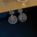 Elegant hollow silver metal double ball drop earrings with intricate lattice pattern - Silver Earring Post - Gun Black / Gunmetal