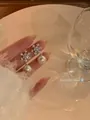 Elegant snowflake stud earrings with white pearl drops for elegant evening wear - Clip-on Style / Silver