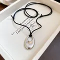 Elegant minimalist silver-tone oval hollow pendant on a stylish adjustable black cord - Silver Hollow Style (19#) / Adjustable / Silver