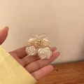 Elegant pearl white rose hair claw clip with transparent amber finish - Champagne Rose Style