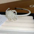 Elegant French style retro white pearl headband featuring a delicate beaded flower detail - Crystal Flower Pearl Style