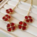 French style vintage gold necklace featuring red flower charms and elegant faux pearls - 40 Necklace - Gold - Red