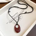 Reddish-brown oval ceramic pendant on black adjustable cord for a niche retro style - Red Ceramic Oval Style (21#) / Adjustable / Red