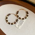 Close-up of retro wooden and ceramic beaded hoop earrings on linen - Style 3(3#)