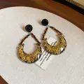 Close-up view of vintage crescent moon drop earrings with gold foil and bead accents. - Style 4(4#)
