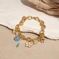 Chunky gold chain charm bracelet featuring ocean theme star, shell and flower pendants - Flower Charm Bracelet (HB2985) / Gold White