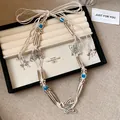 Bohemian gewebte Hanfseil-Taillenkette mit blauen Perlen und silbernen Schmetterlingen - Schmetterling Blau Perlen Stil / Silber-Weiß