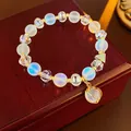 Elegantem Perlenarmband mit Opalglas und Kristallen, Goldakzenten und Käfiganhänger - 66# Armband / Weiß
