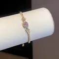 Elegante bracciale in stile francese con zircone rosa e finitura dorata per donna - Oro-Rosa