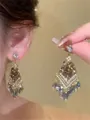 Detail view of elegant silver needle earrings featuring zircon flower and crystal tassels - 28# Silver Pin - Gold Blue
