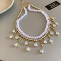 Elegant double-layer pearl necklace with shimmering zircon teardrop tassels detail - 双层水滴流苏项链(HN2126) / Gold