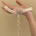 Detail view of double-layer pearl necklace featuring a large elegant crystal butterfly - Double Layer Butterfly Pearl Tassel Necklace (6#) / Silver