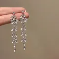 Detail shot of sparkling silver flower earrings with marquise-cut zircons - 9# Silver Color with Silver Pin